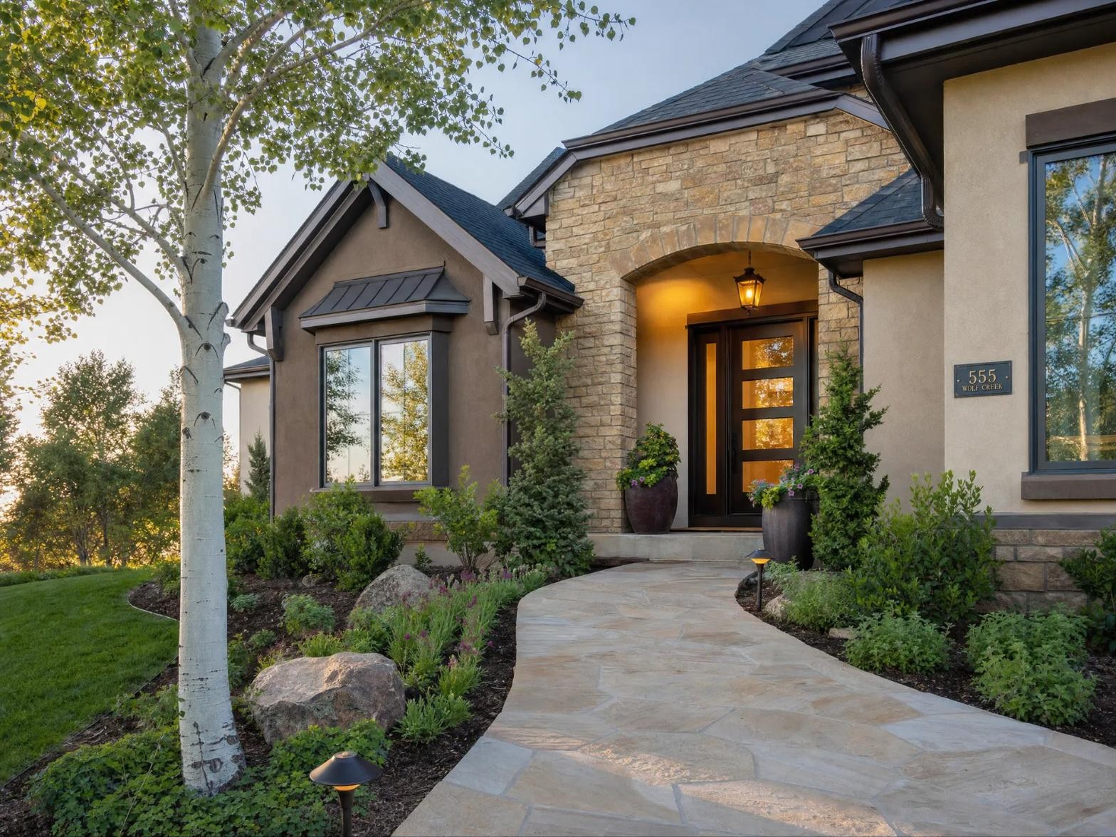 Elegant Colorado home entrance at golden hour